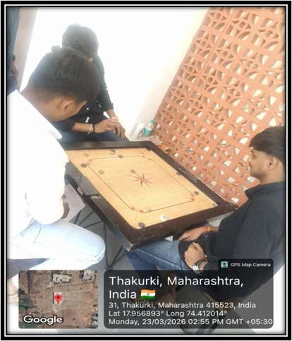 Carrom Competition 2026 at Pharmacy College Phaltan 2 D Pharmacy students playing carrom during student activity at College of Pharmacy Phaltan