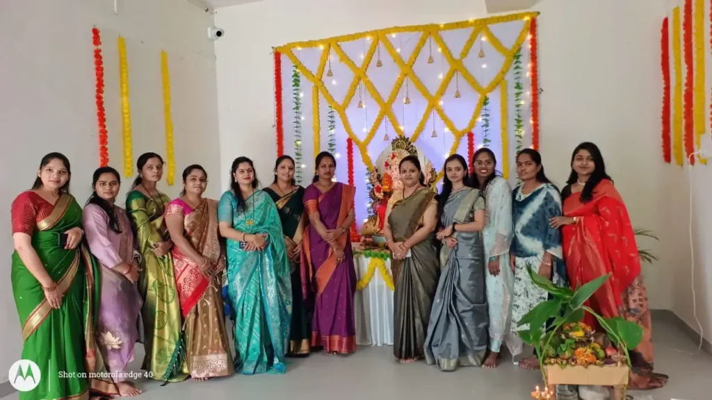 Faculty members in traditional attire during Traditional Day celebration at PES College of Pharmacy Phaltan