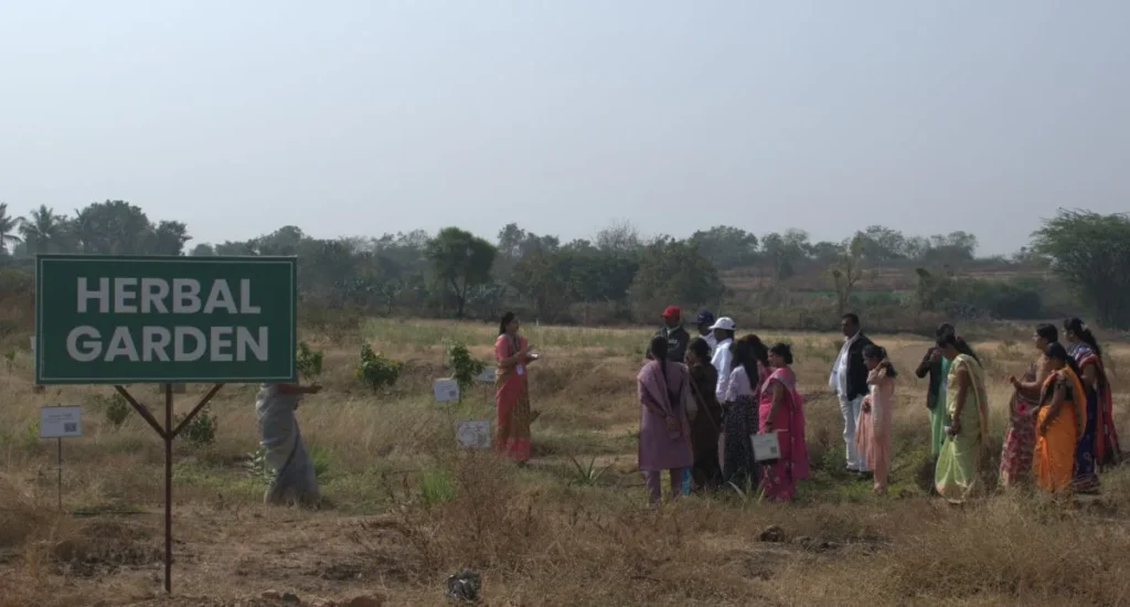 Induction Programme 2025 at PES College of Pharmacy Phaltan 7 Students and parents visiting Herbal Garden during pharmacy Induction Programme at PES College Phaltan