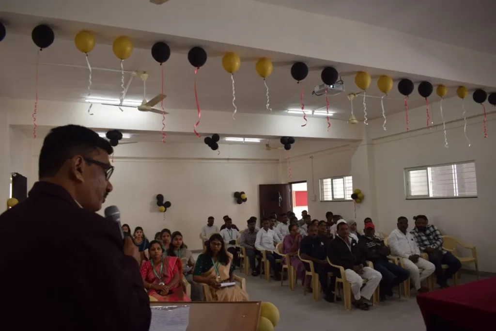 Induction Programme 2025 at PES College of Pharmacy Phaltan 3 Principal Dr V T Deshmukh addressing students and parents during Induction Programme 2025