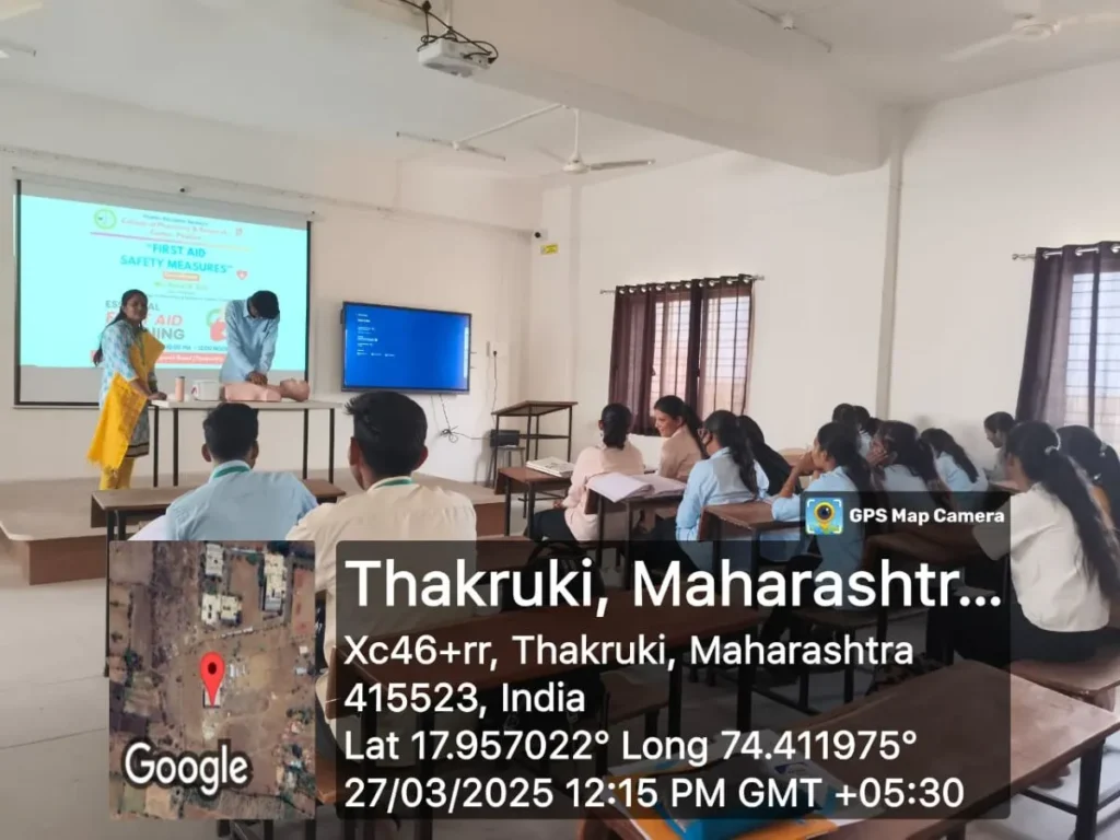 First Aid Safety Measures Seminar for Pharmacy Students | PESCOP Phaltan 2 Pharmacy students learning CPR and first aid safety measures in Phaltan