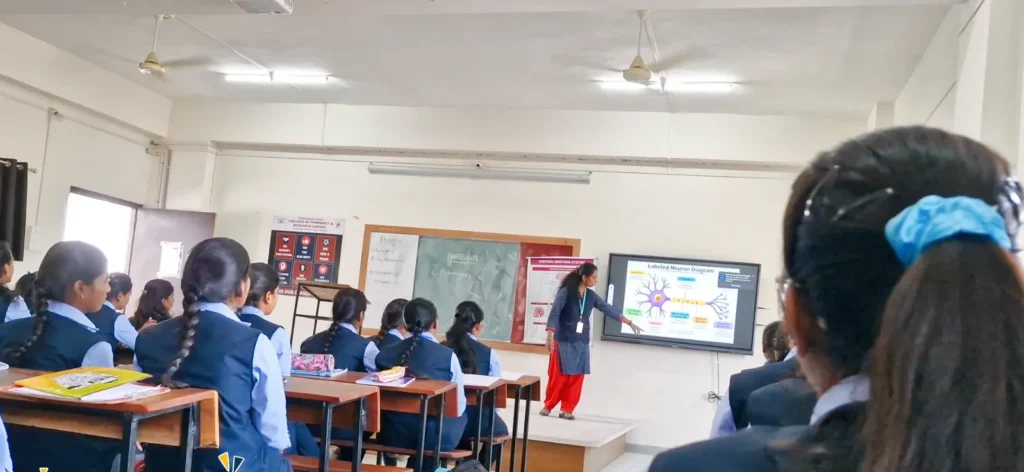 Pharmacy students participating in laboratory practical training at PES College of Pharmacy and Research Center Phaltan